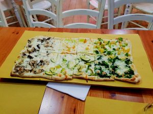 Mixed pizza slices on table