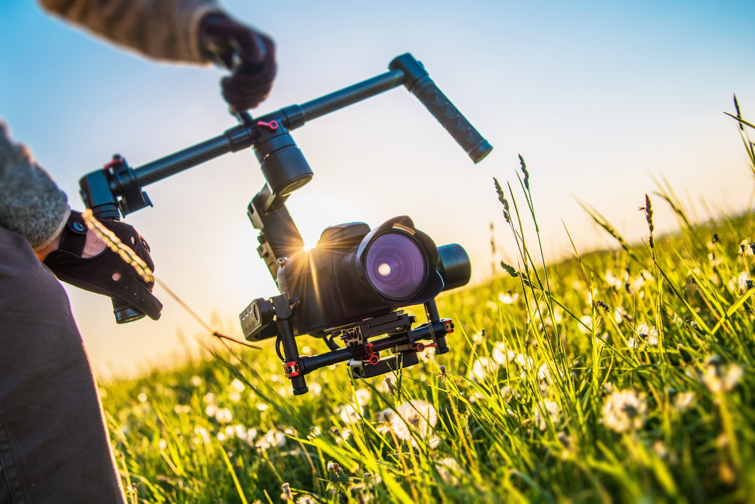 Video Camera Gimbal Stabilization Equipment. Digital SLR Videography Concept. Taking Shoots From the Gimbal.