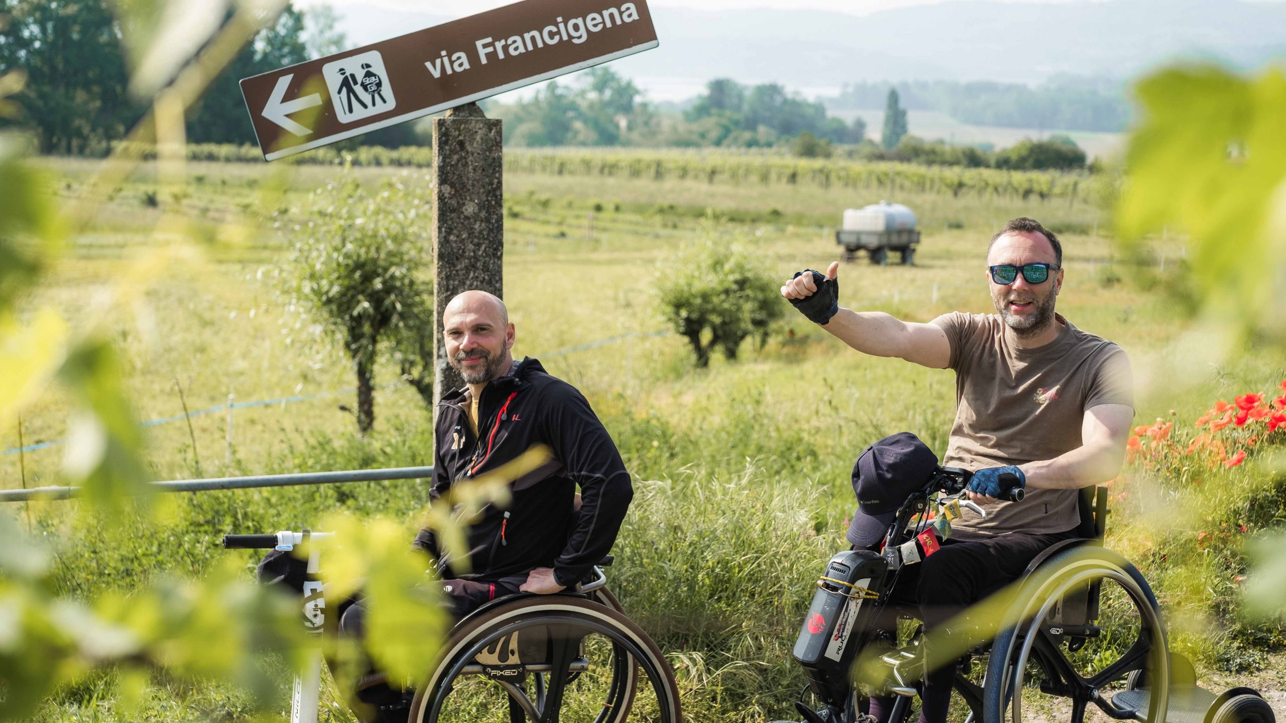 Two people in wheelchair on the pilgrimage route